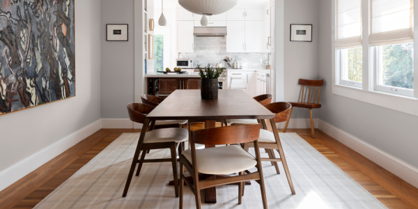 Dining room with plaid area rug 